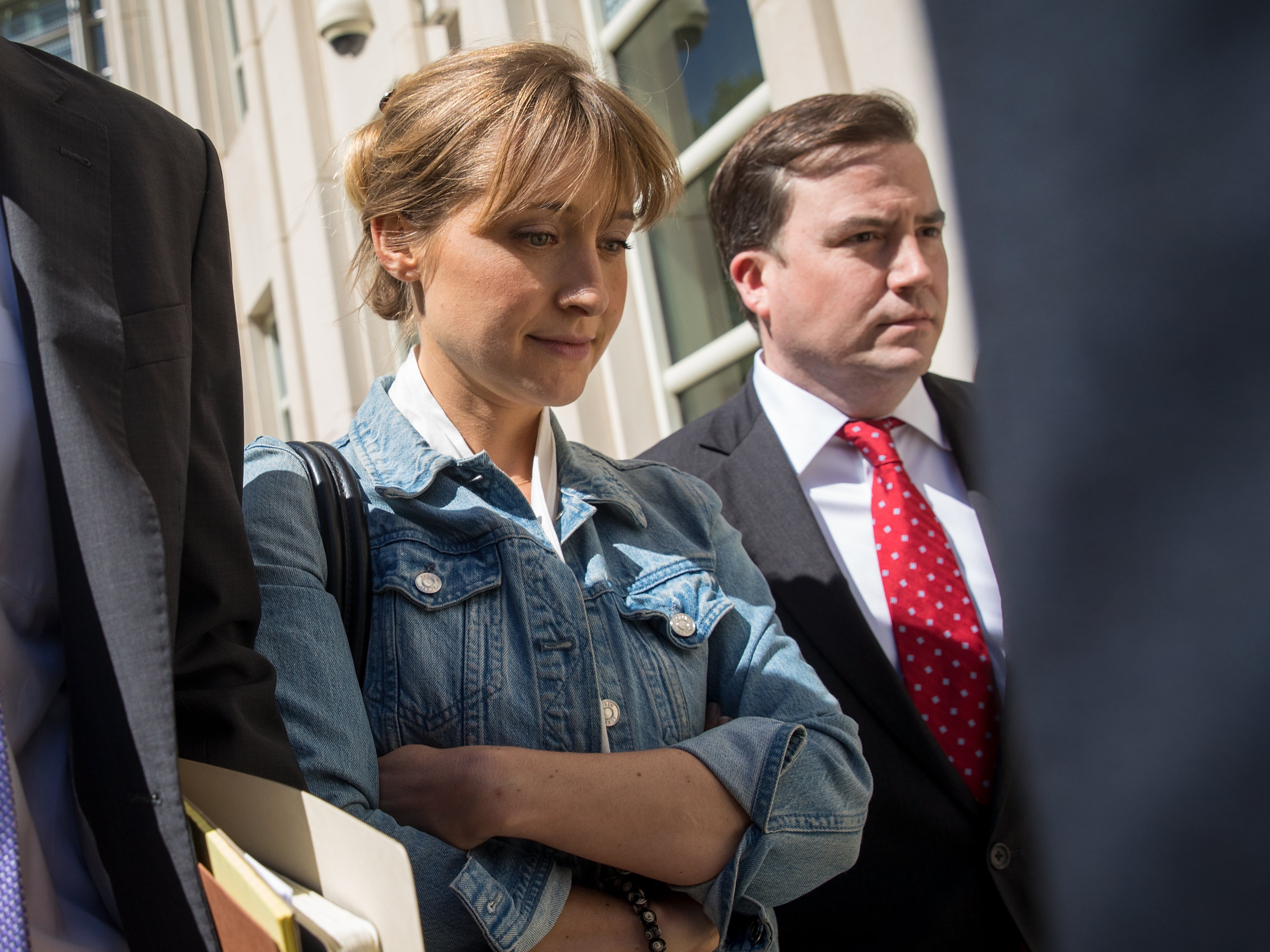 Allison Mack exits the US District Court for the Eastern District of New York following a status conference on 12 June 2018 in the Brooklyn borough of New York City