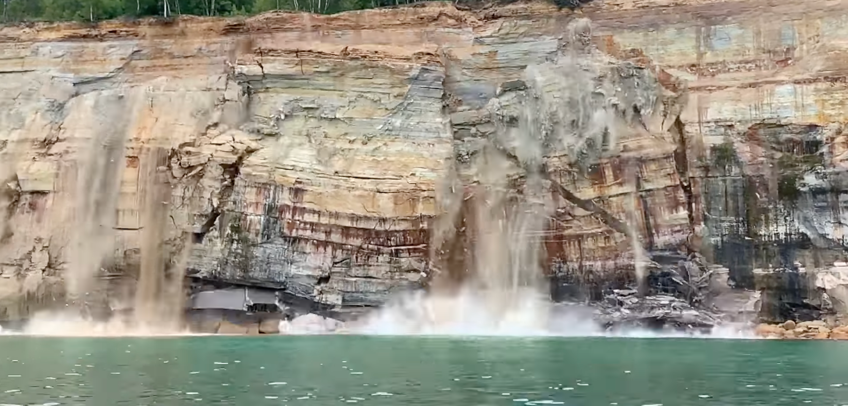<p>A 200ft chunk of cliff fell into Lake Superior in Michigan’s Upper Peninsula this weekend </p>