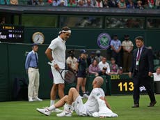 Roger Federer through to Wimbledon second round as Adrian Mannarino retires with injury