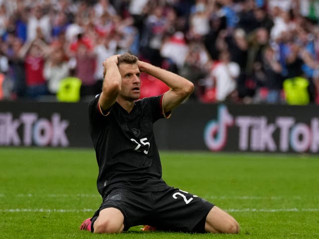 <p>Thomas Muller reacts after his miss against England</p>