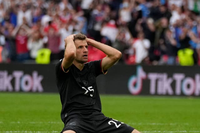 <p>Thomas Muller reacts after his miss against England</p>