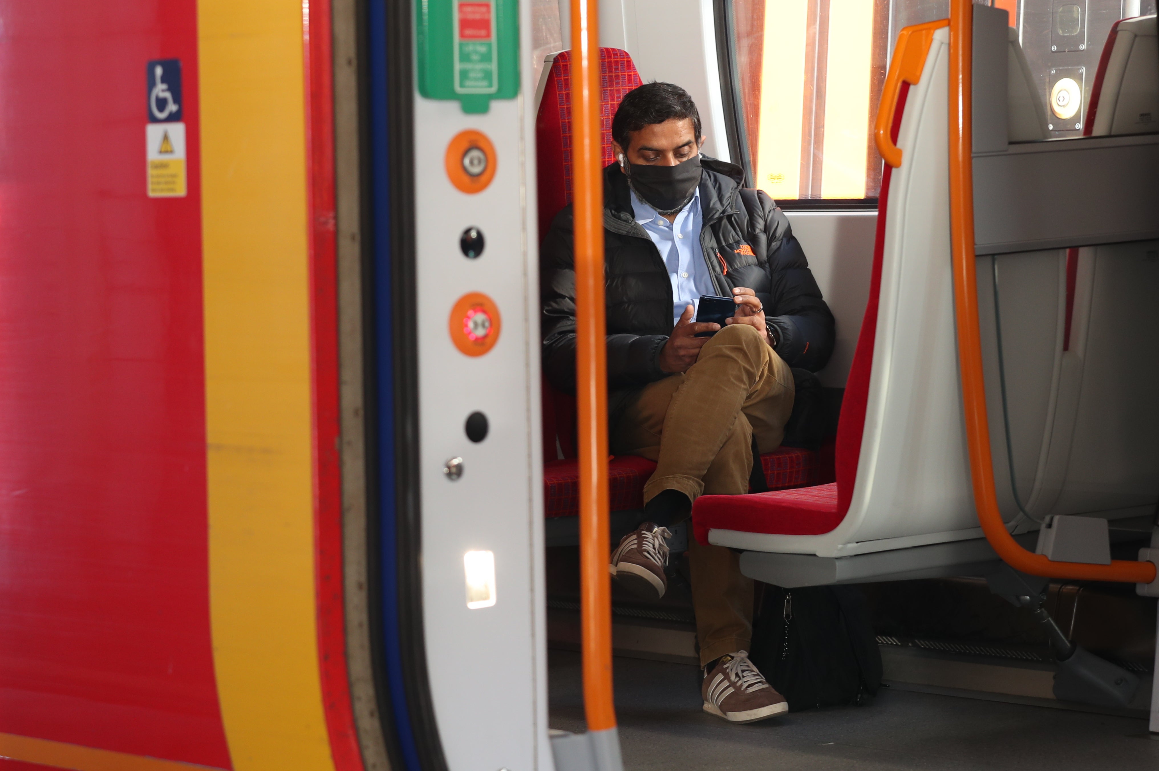 A passenger sits on a train