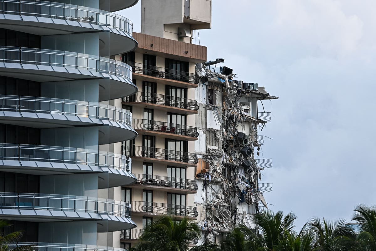 Firefighters offer cat food to missing pets trapped alive in the Miami condo collapse rubble