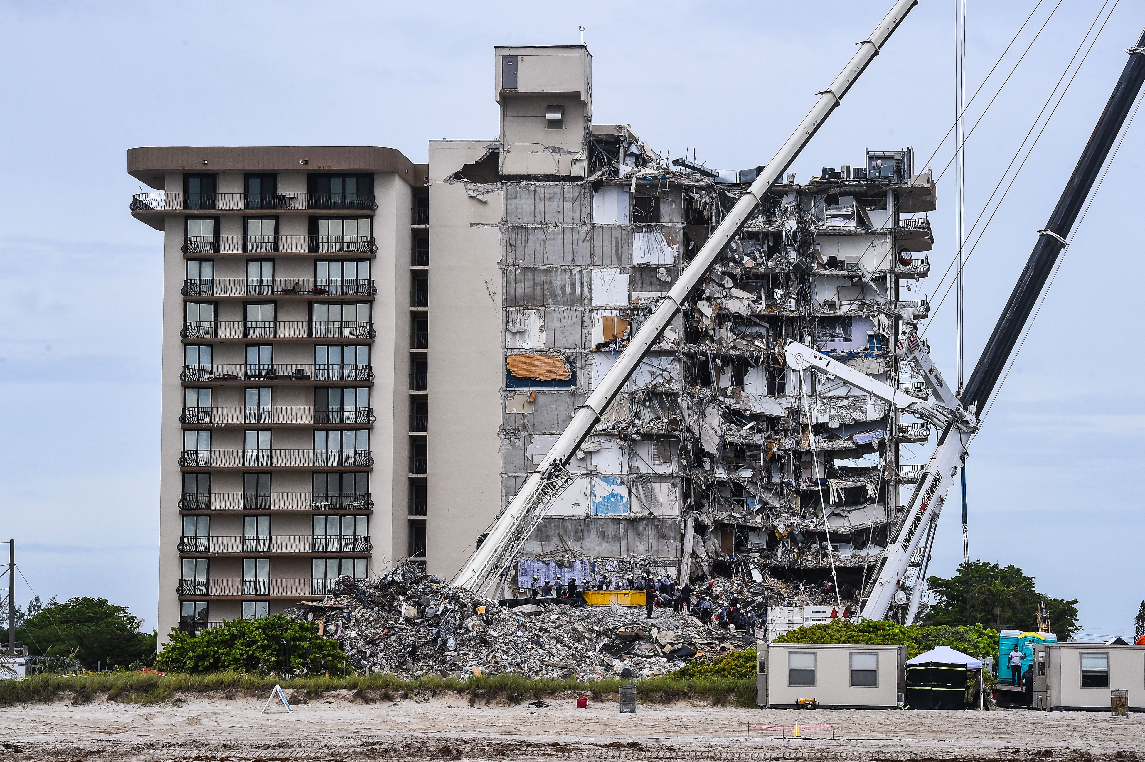 Search and Rescue teams look for possible survivors in the partially collapsed 12-story Champlain Towers South condo building on 29 June 2021 in Surfside, Florida