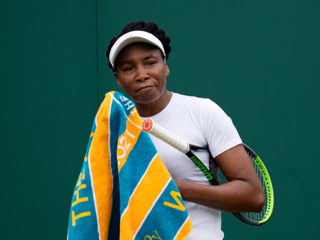 <p>Venus Williams of the US uses a towel during the women's singles first round match against Romania's Mihaela Buzarnescu on day two of the Wimbledon Tennis Championships in London</p>