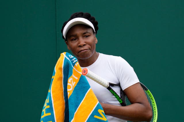 <p>Venus Williams of the US uses a towel during the women's singles first round match against Romania's Mihaela Buzarnescu on day two of the Wimbledon Tennis Championships in London</p>
