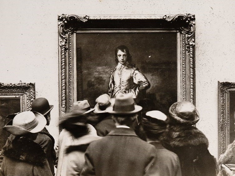 People looking at the Blue Boy by Thomas Gainsborough, which was last on show at the London gallery on 25 January 1922