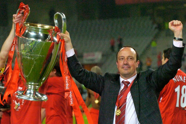 <p>Rafael Benitez holds the Champions League trophy aloft after his 2005 victory with Liverpool</p>