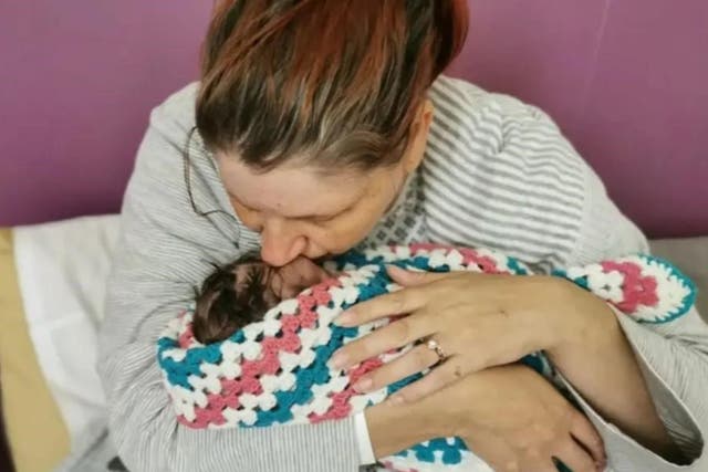 <p>Sarah Andrews with baby Wynter Andrews, who died after mistakes at Nottingham University Hospital Trust </p>