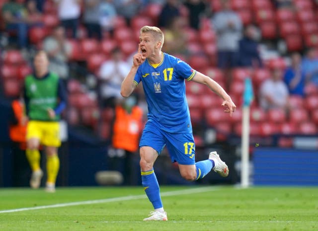 <p>Oleksandr Zinchenko celebrates scoring against Sweden</p>