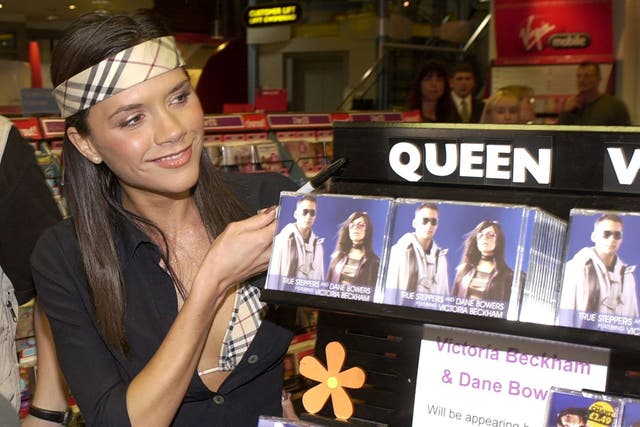 <p>Queen Vic: Beckham promotes ‘Out of Your Mind’ at a Virgin Megastore in Cardiff in 2000</p>