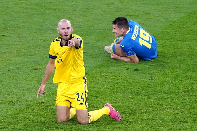 Ukraine's Artem Besedin (right) in the aftermath of Marcus Danielson's (left) red card challenge on him
