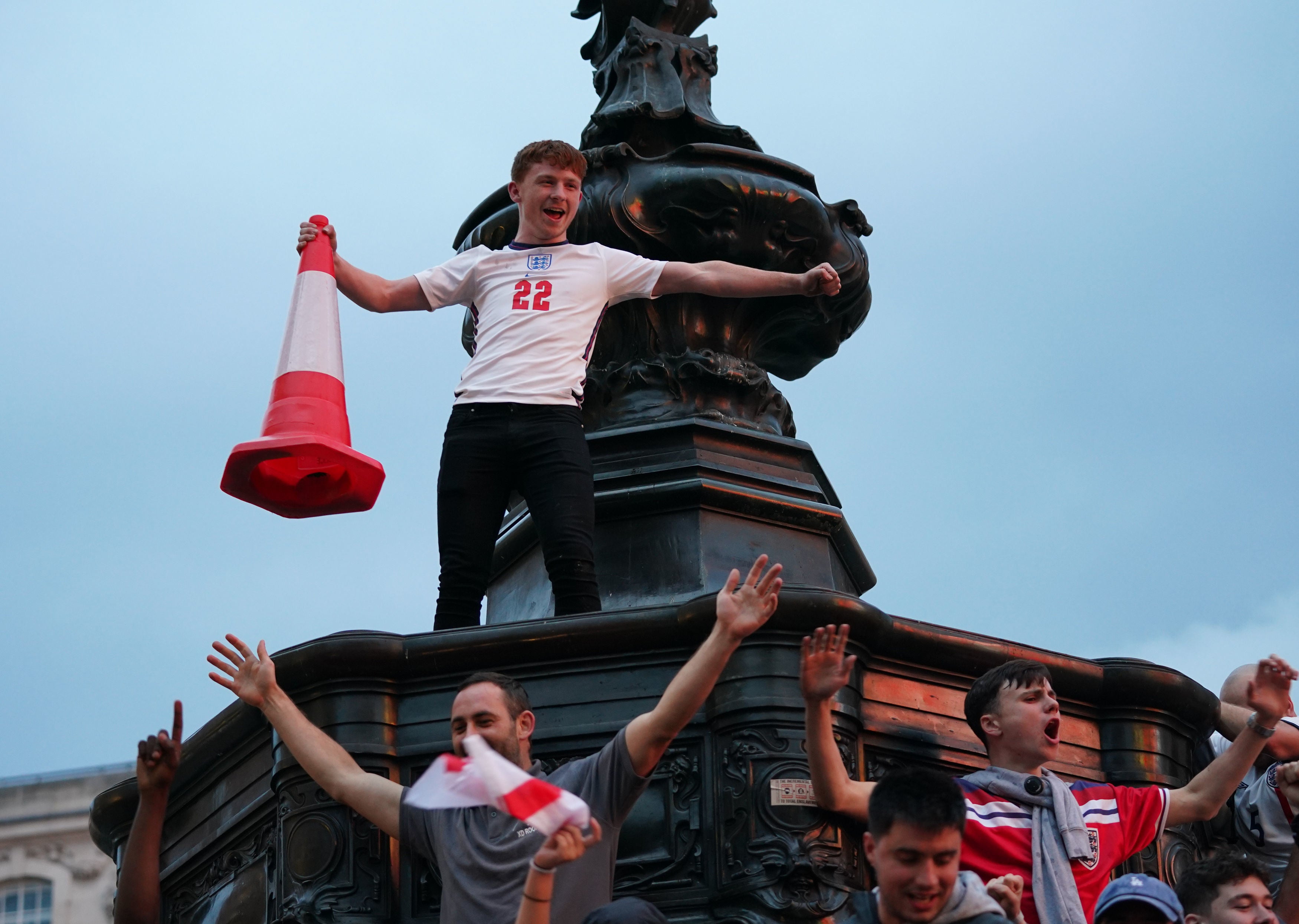 Fans gather under the Statue of Eros in Piccadilly Circus, London, celebrating England’s victory