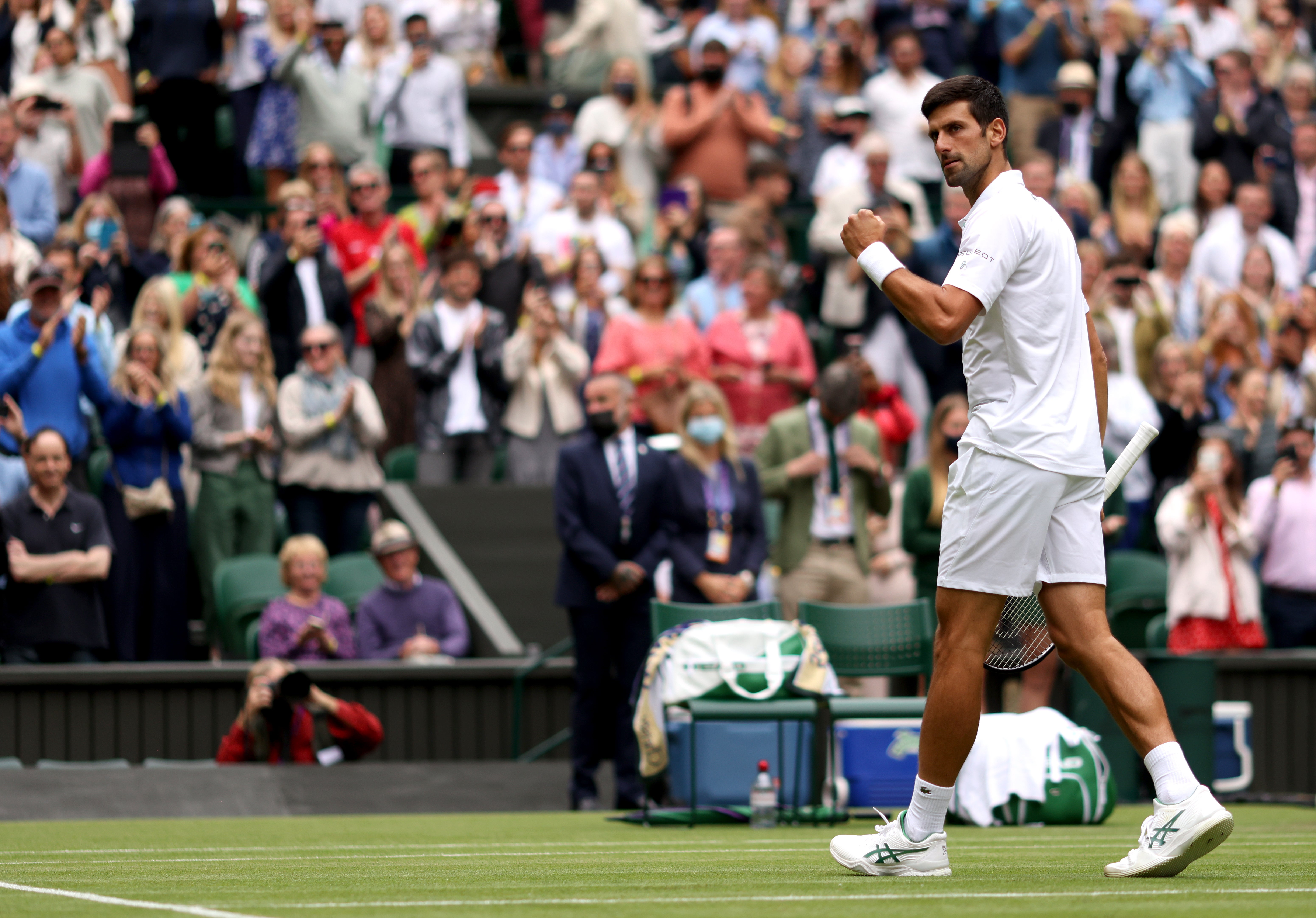 Novak Djokovic made it through to round three with a straight-sets win against Kevin Anderson at Wimbledon
