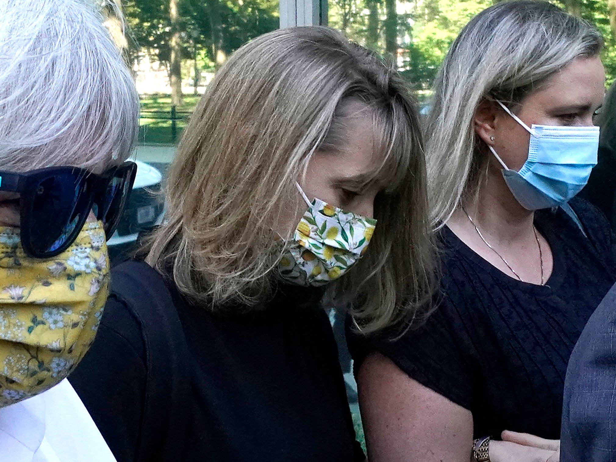 <p>Allison Mack (center) arrives for her sentencing hearing on 30 June 2021 in Brooklyn</p>