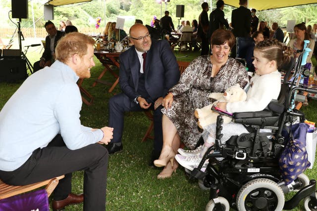 <p>The Duke of Sussex speaking to Inspirational Child award winner Carmela Chilery-Watson during the WellChild Awards 2021 at Kew Gardens, London</p>