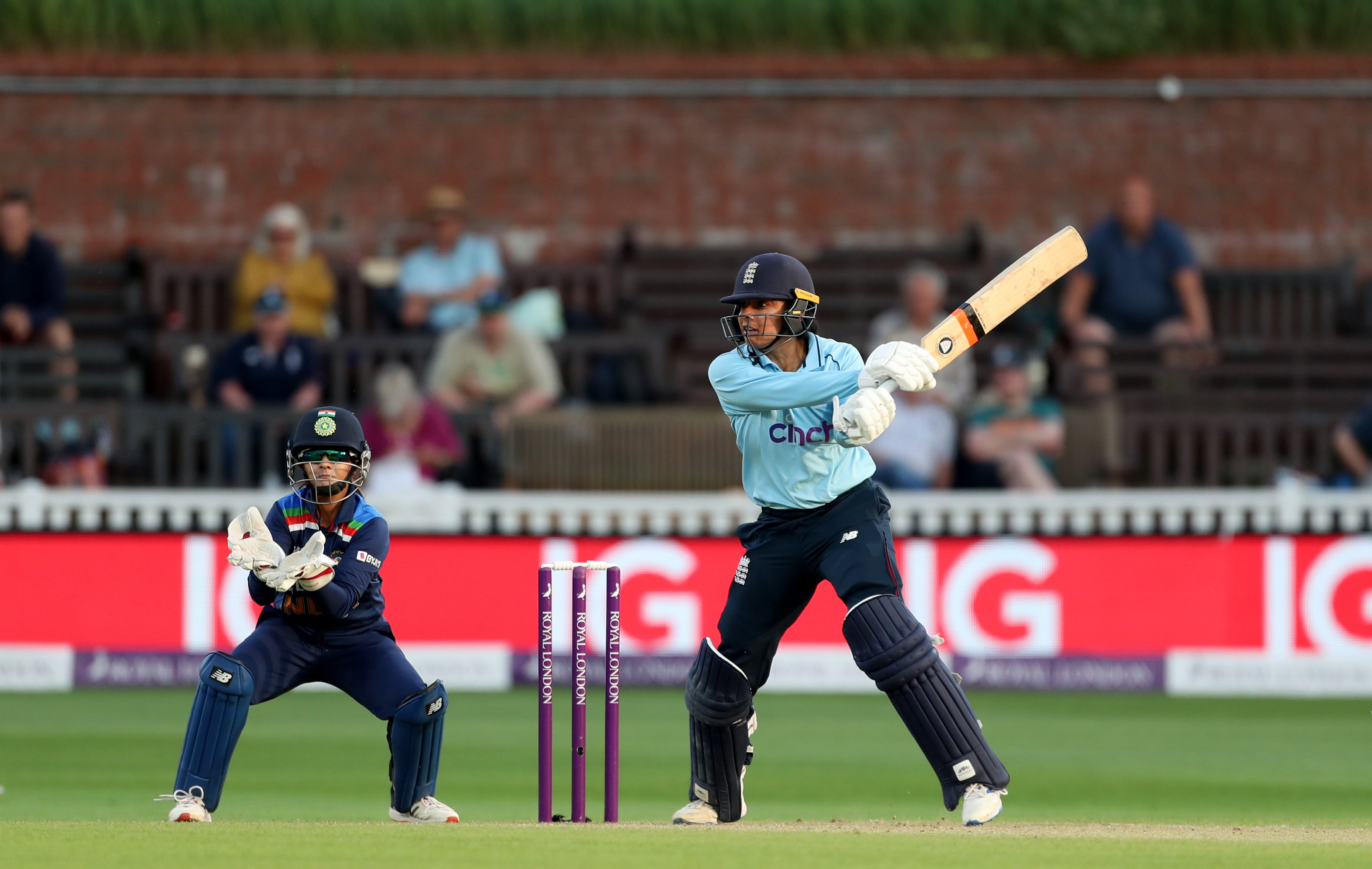 A record-breaking 92-run partnership between Sophia Dunkley and Katherine Brunt was enough to see England Women chase India's total of 221