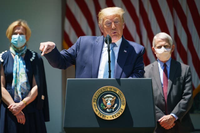 <p>US President Donald Trump speaks on vaccine development in the Rose Garden of the White House in Washington, DC, flanked by White House Coronavirus Task Force Deborah Birx and Director of the National Institute of Allergy and Infectious Diseases Anthony Fauci</p>