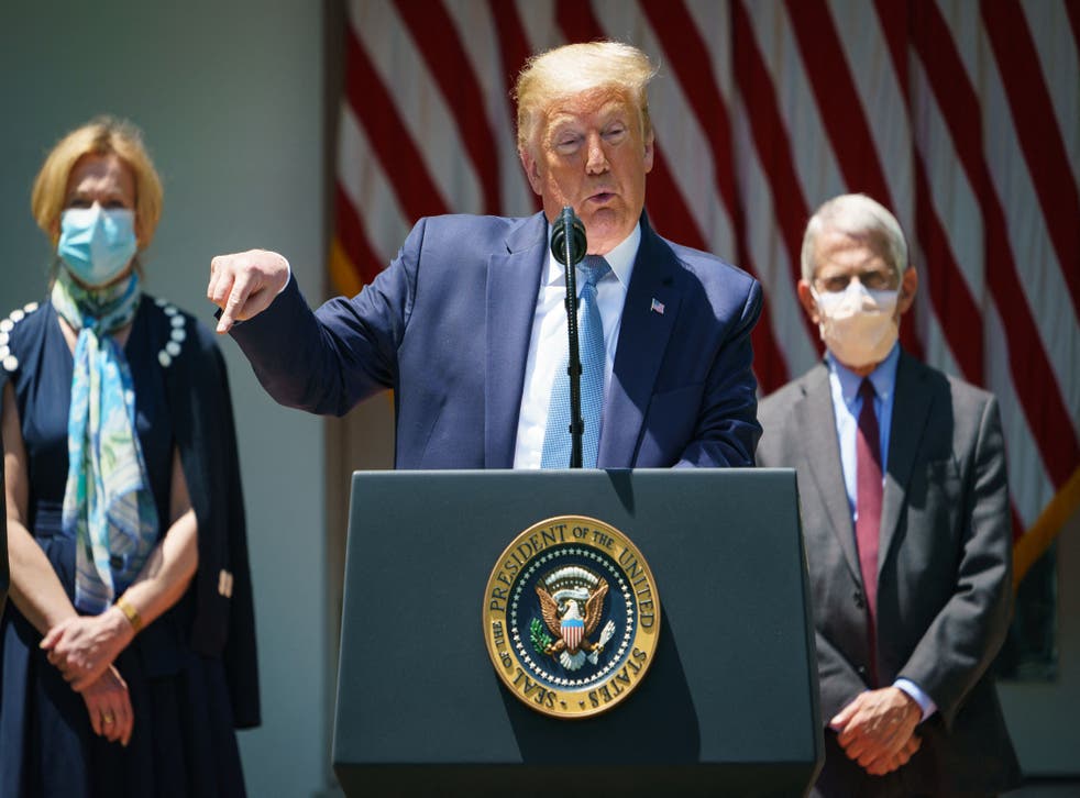 <p>US President Donald Trump speaks on vaccine development in the Rose Garden of the White House in Washington, DC, flanked by White House Coronavirus Task Force Deborah Birx and Director of the National Institute of Allergy and Infectious Diseases Anthony Fauci</p>