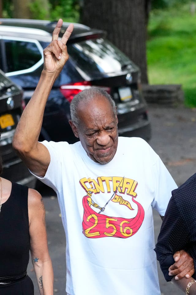 <p>Bill Cosby gestures as he approaches members of the media gathered outside his home in Elkins Park, Pa., following his release from prison Wednesday, June 30, 2021</p>