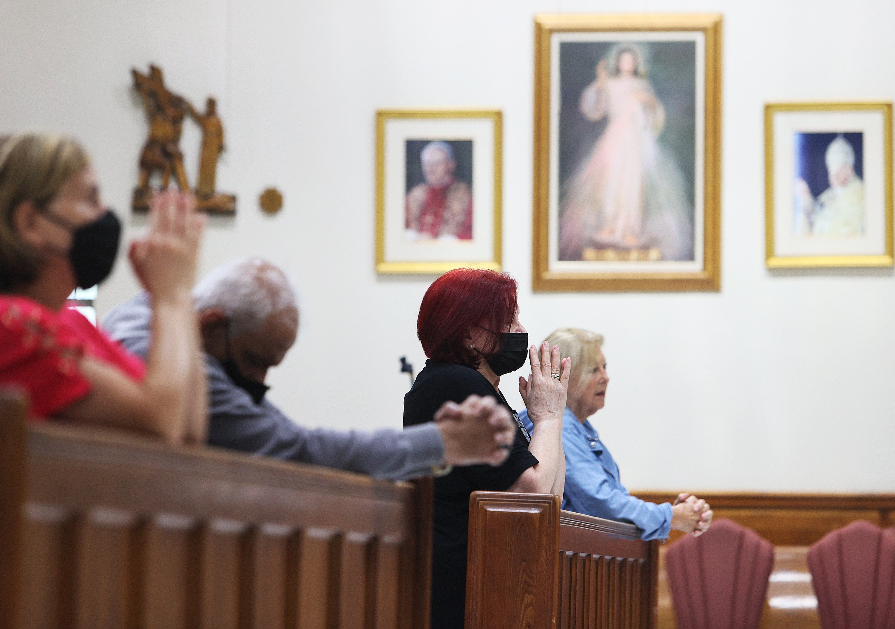 <p>Residents pray for victims and families at service at Surfside’s Saint Joseph Catholic Church</p>