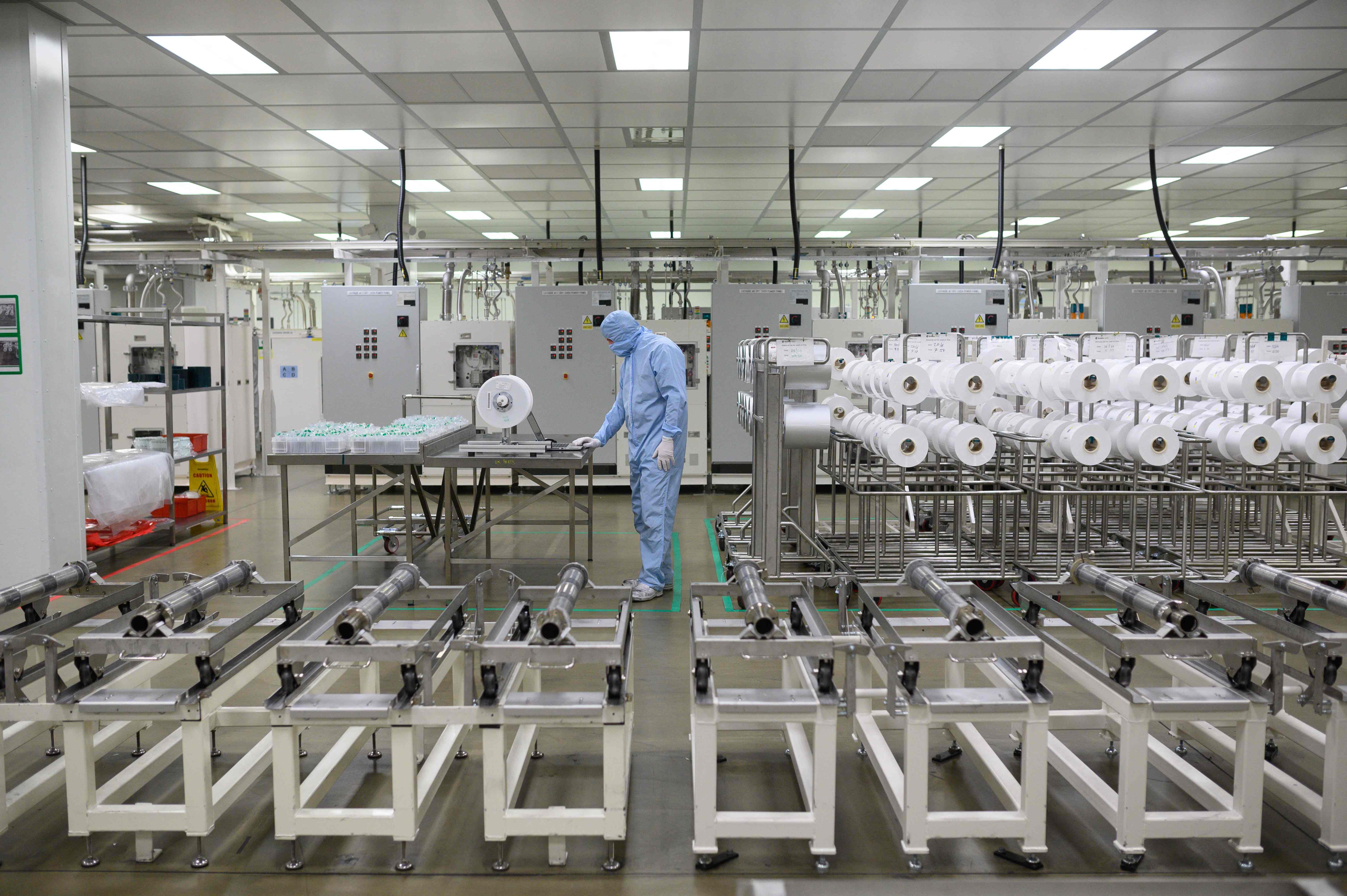 Employees work at the Envision battery manufacturing plant for the Nissan Leaf car at the carmaker’s plant in Sunderland