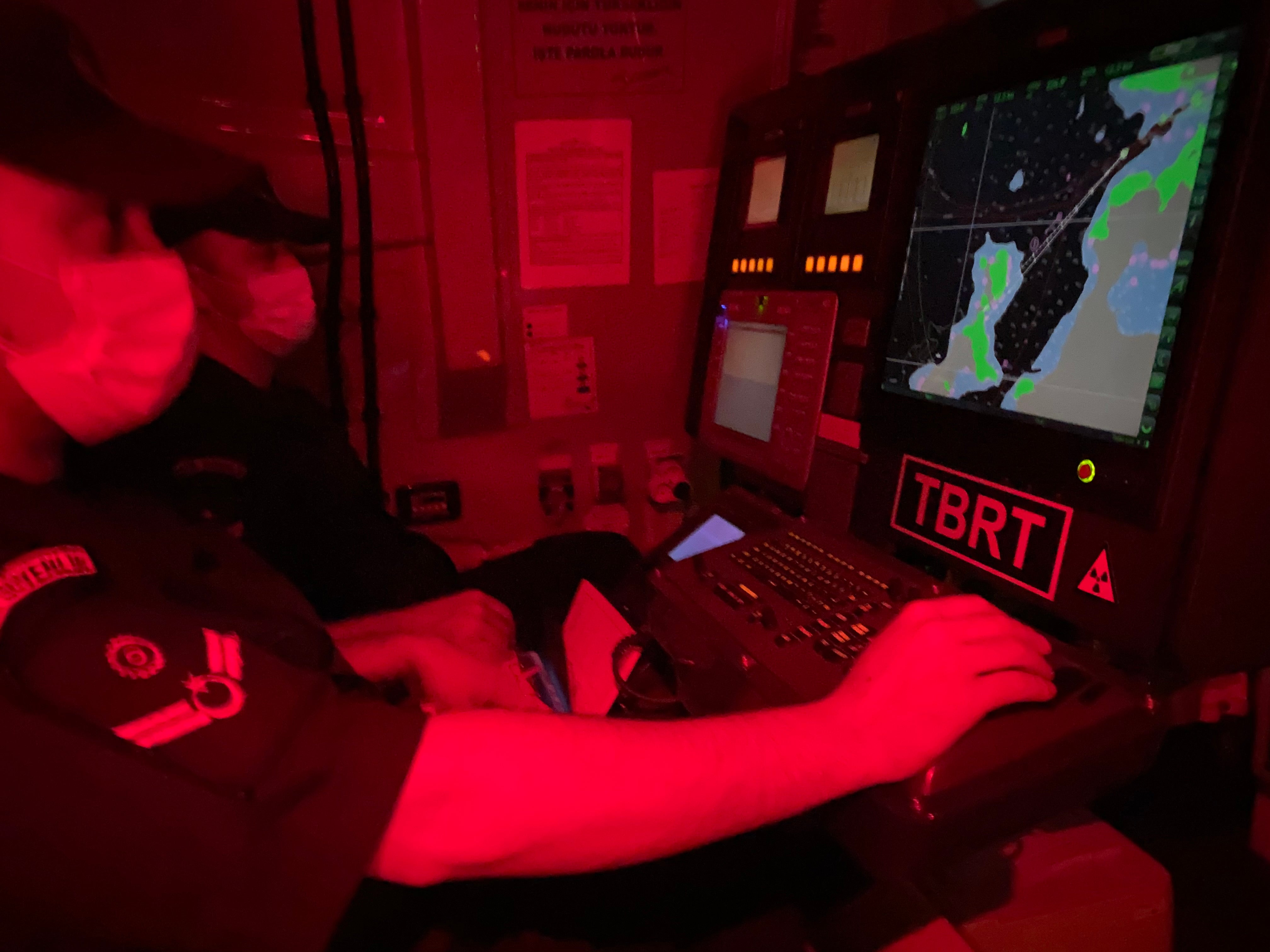 Coastguard officers use sophisticated technology to track migrants