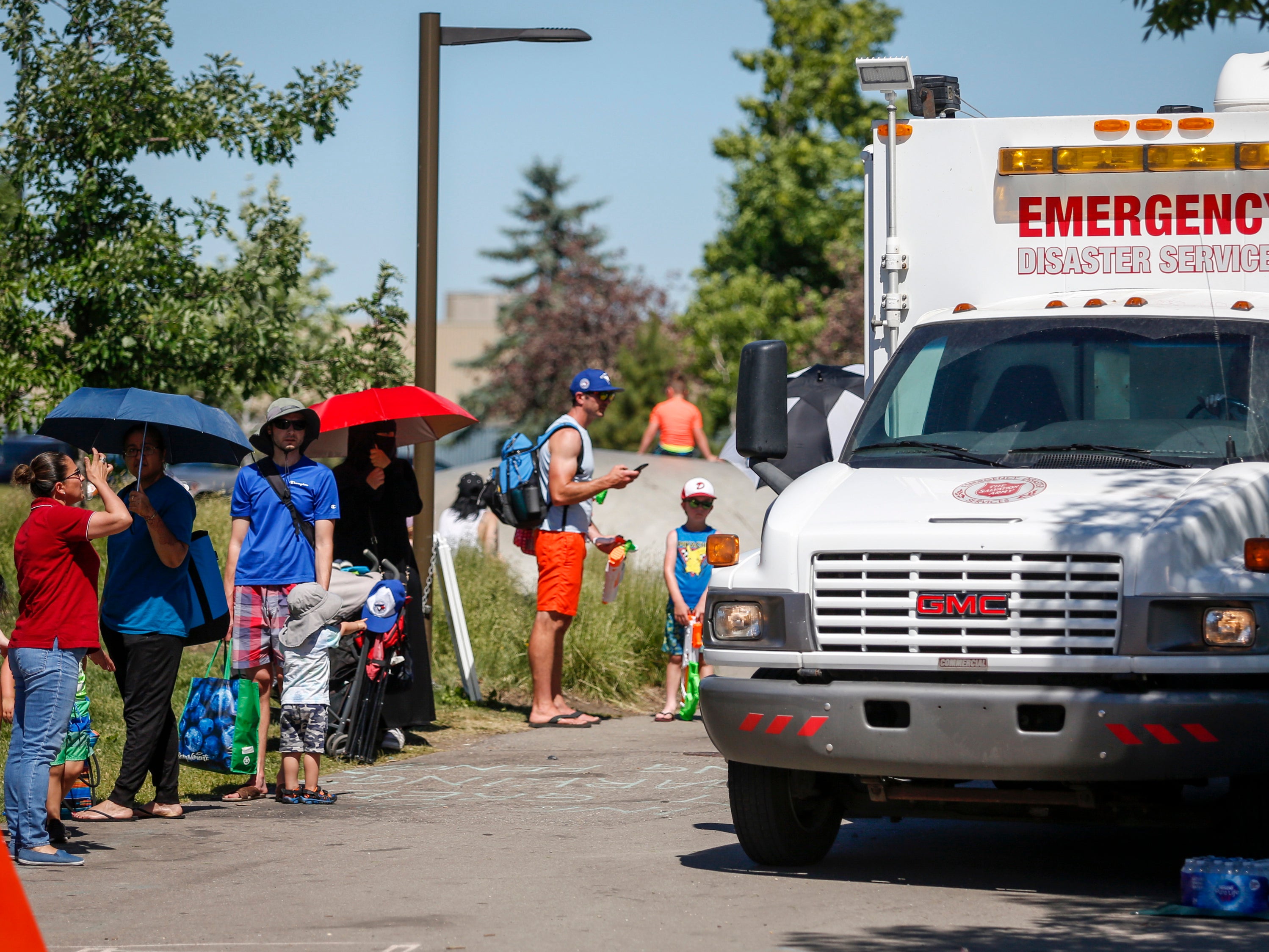 A Salvation Army vehicle is set up as a cooling station