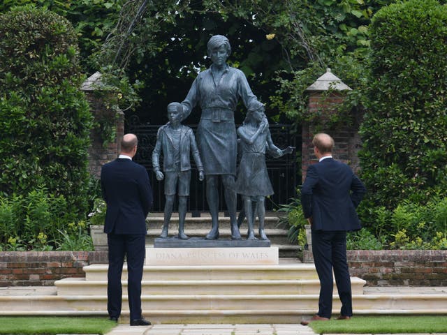 <p>The Duke of Cambridge (left) and Duke of Sussex look at a statue they commissioned of their mother Diana, Princess of Wales, in the Sunken Garden at Kensington Palace, London, on what would have been her 60th birthday</p>