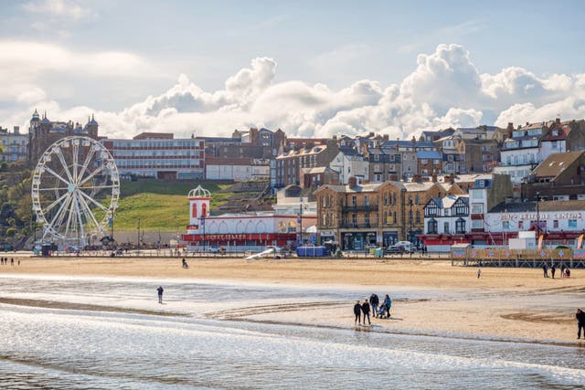 <p>People enjoying the beach at Scarborough in the sunshine</p>