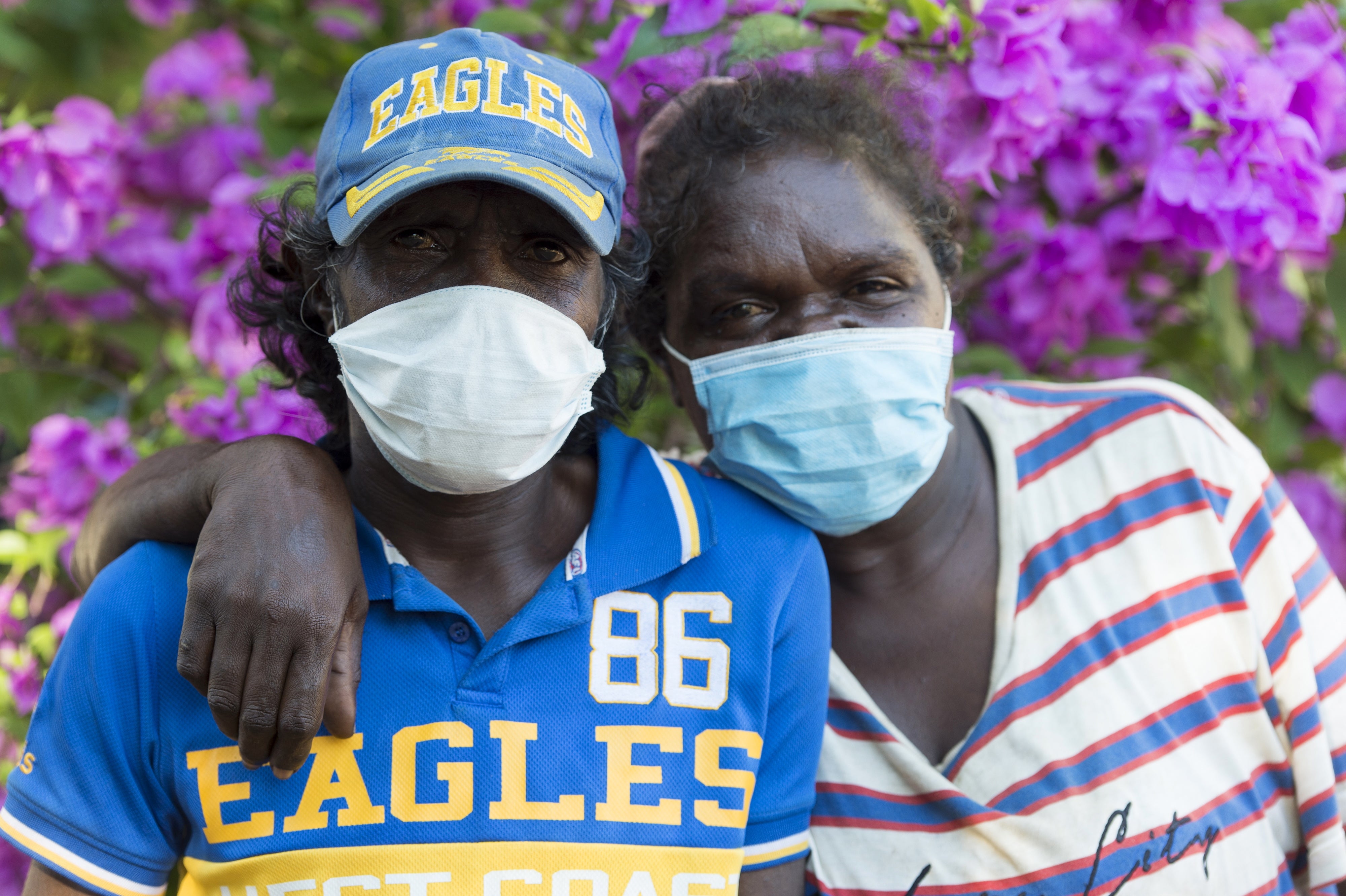 Aboriginal rough sleepers pose for photographs during lockdown in Darwin