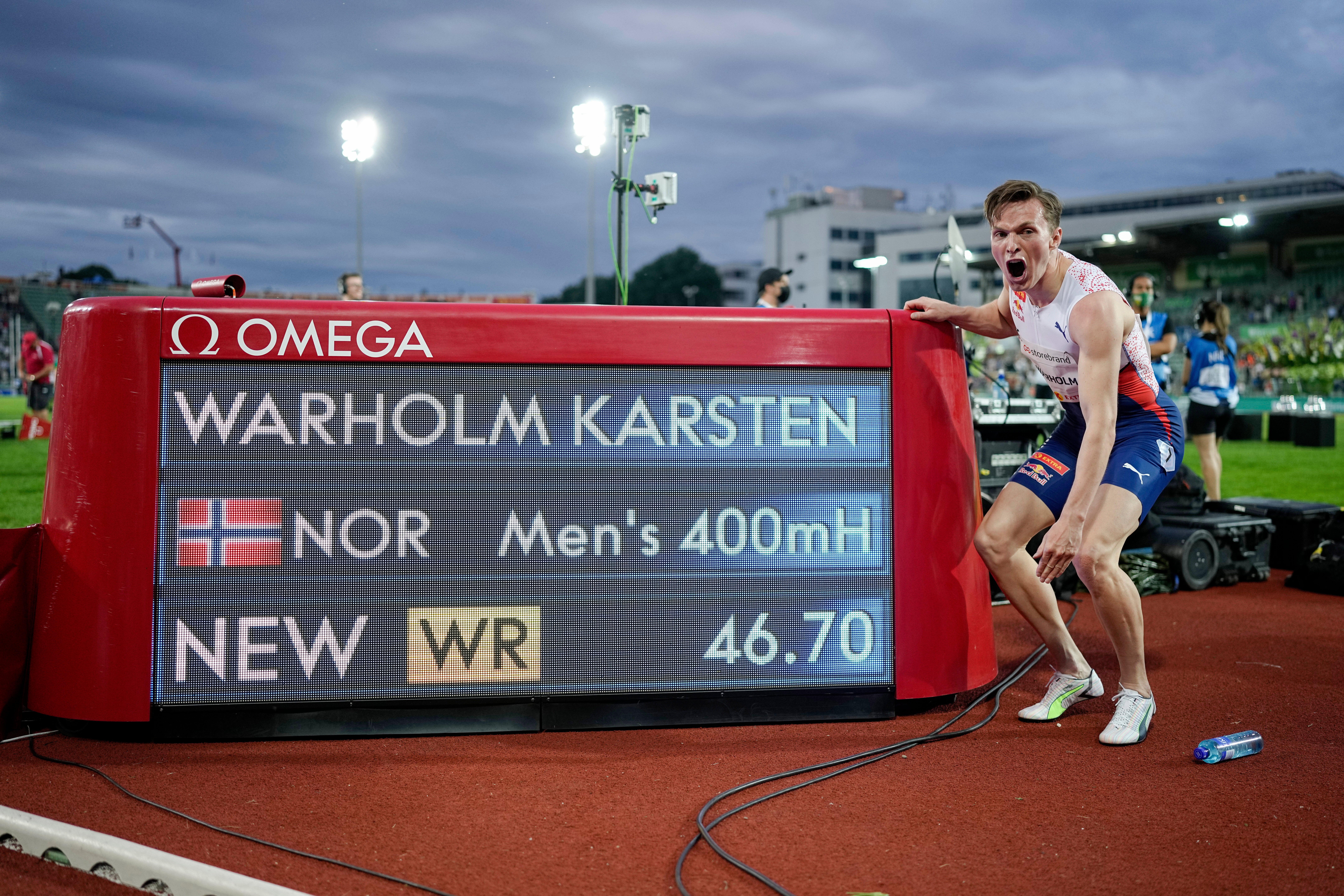 Norway’s Karsten Warholm celebrates his world record