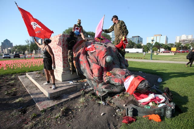 <p>A defaced statue of Queen Victoria lies after being toppled during a rally on Canada Day in Winnipeg</p>