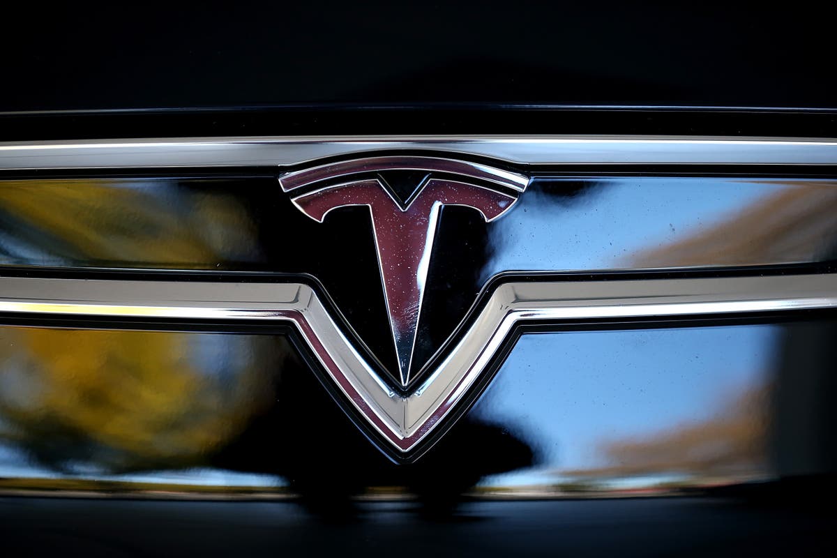 Tesla erupts in flames briefly trapping owner, say attorneys