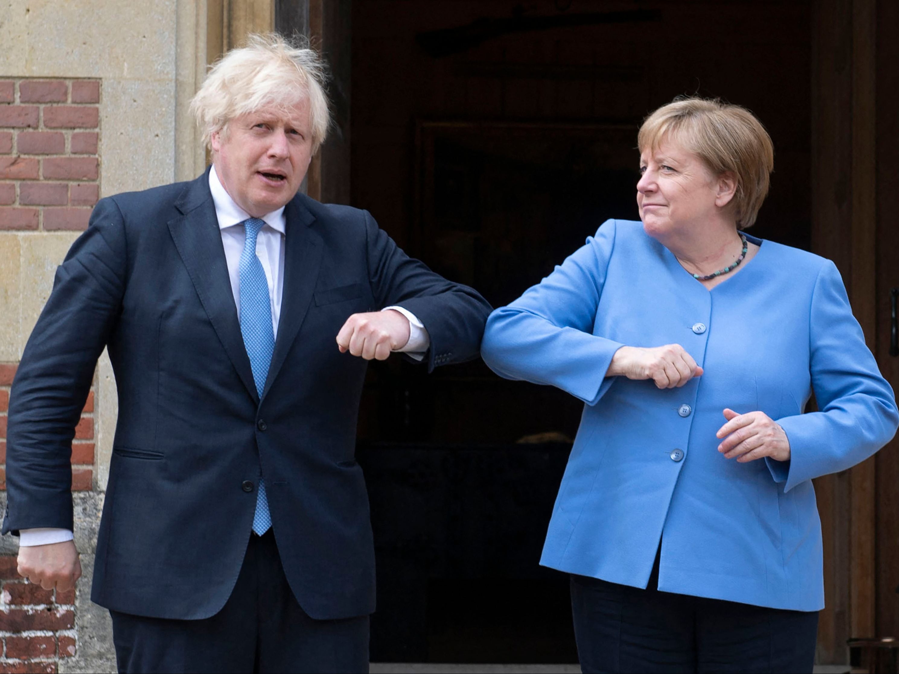 Boris Johnson welcomes German chancellor Angela Merkel to Chequers with an elbow bump on Friday