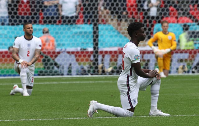 <p>England team members take the knee in solidarity for Black Lives Matter ahead of their game against Germany at Euro 2020</p>