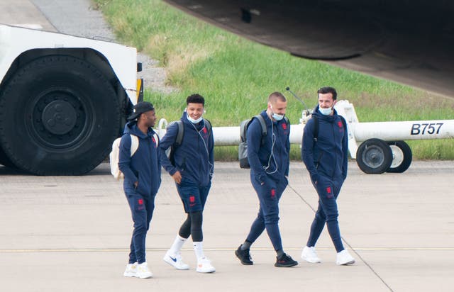 <p>England’s Raheem Sterling, Jadon Sancho, Luke Shaw and Ben Chilwell on the tarmac heading to board the plane</p>