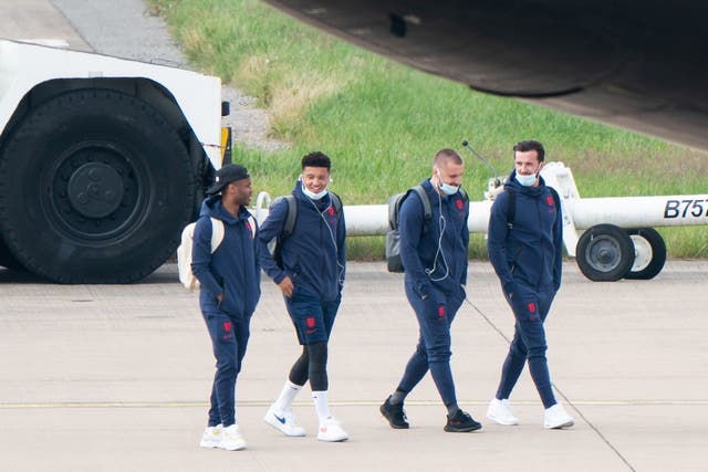 <p>England’s Raheem Sterling, Jadon Sancho, Luke Shaw and Ben Chilwell on the tarmac heading to board the plane</p>