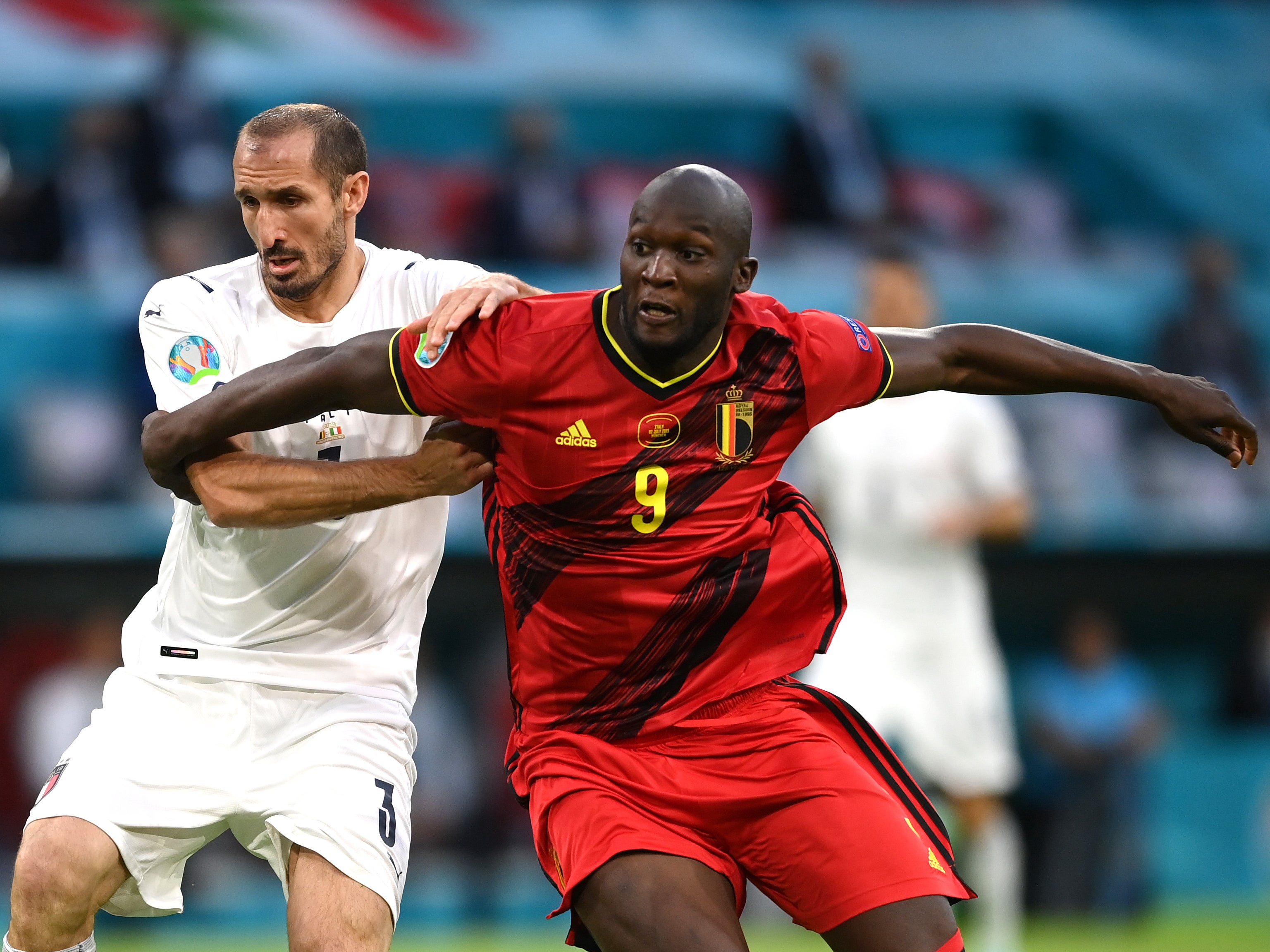 Romelu Lukaku of Belgium battles for possession with Giorgio Chiellini of Italy