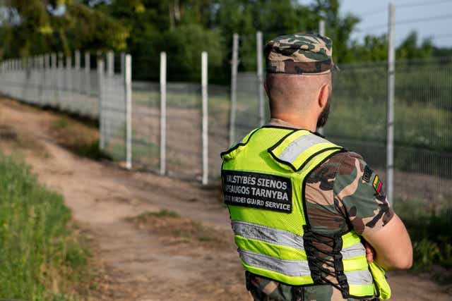 <p>Lithuania State Border guard Vytautas Makauskas on patrol near Poskonys amid an influx from Belarus</p>