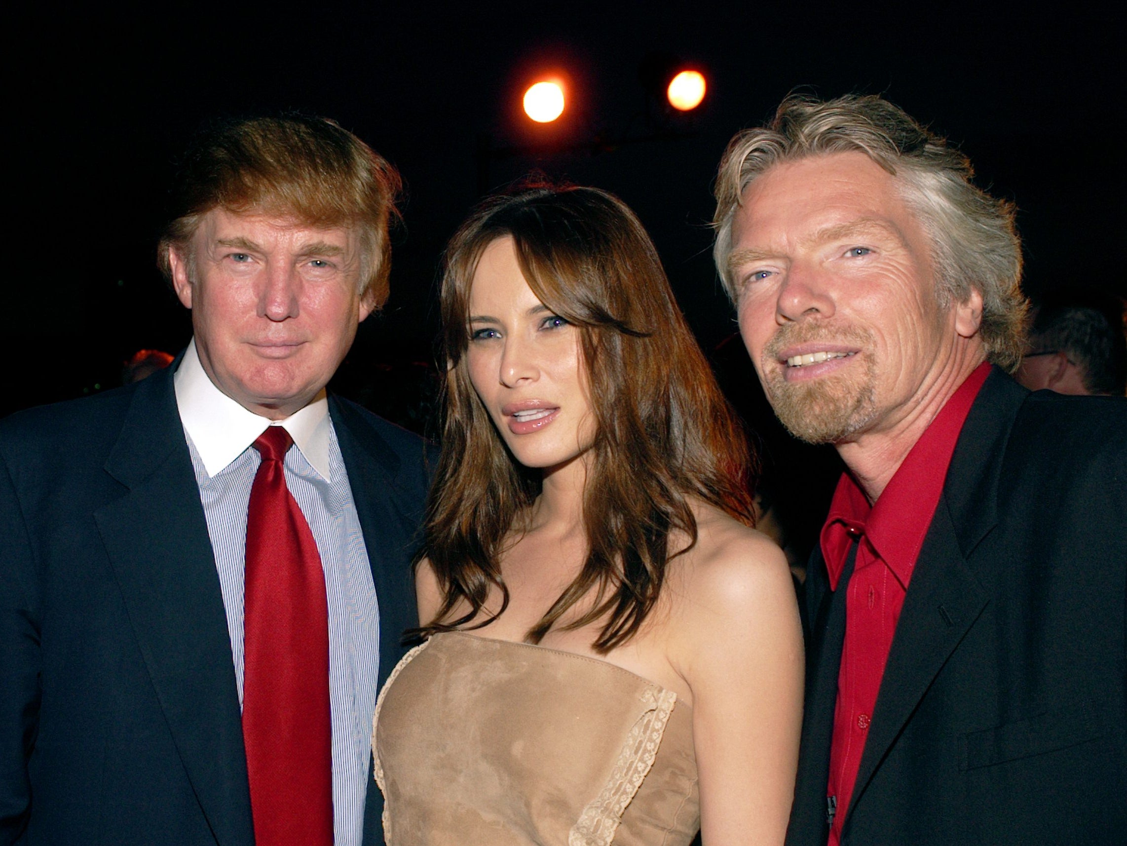 With former president Donald Trump and wife Melania at the launch of Virgin Mobile USA