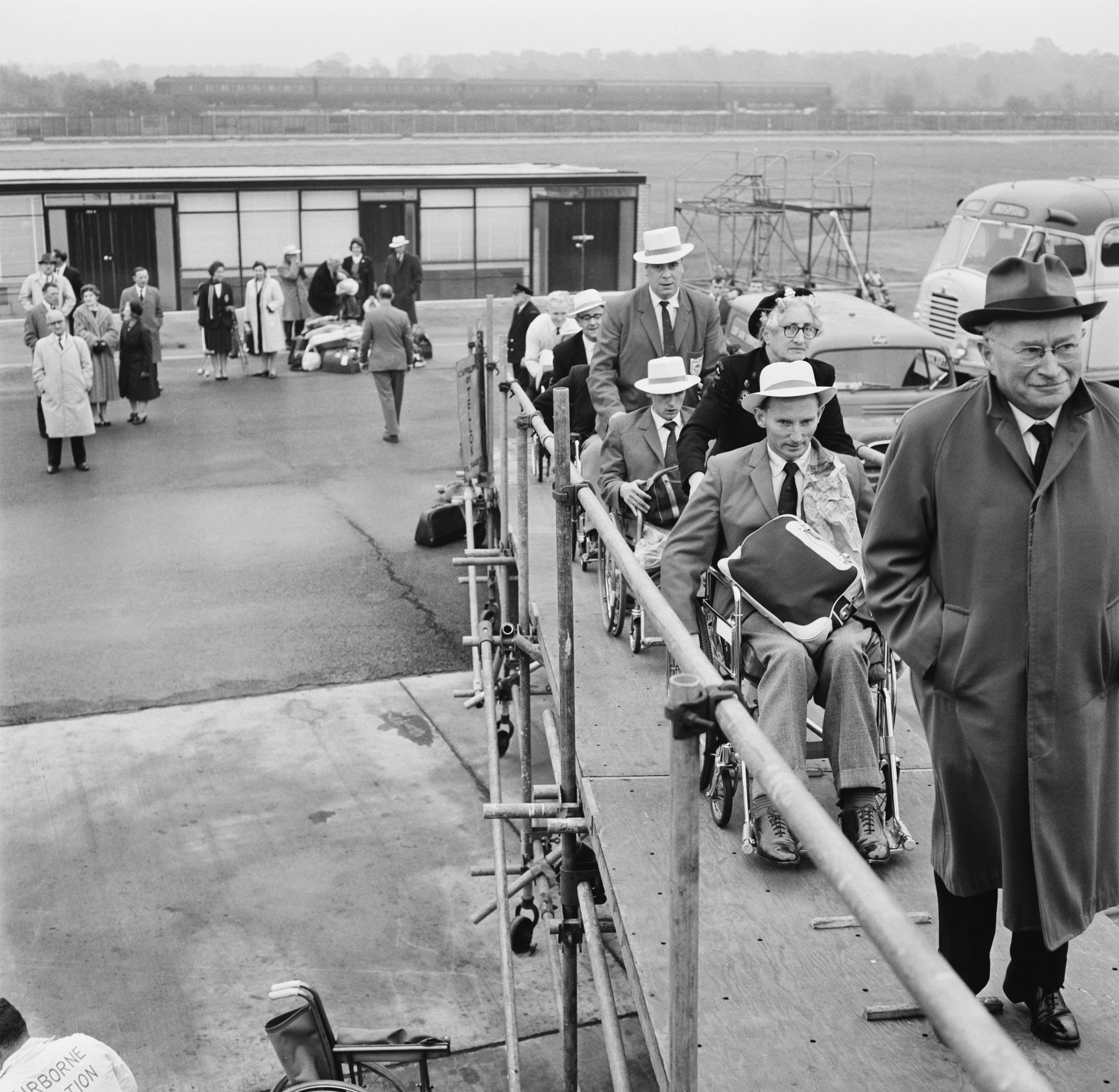 Sir Ludwig Guttmann leads members of Britain's team to Perth for the 1962 Commonwealth Paraplegic Games