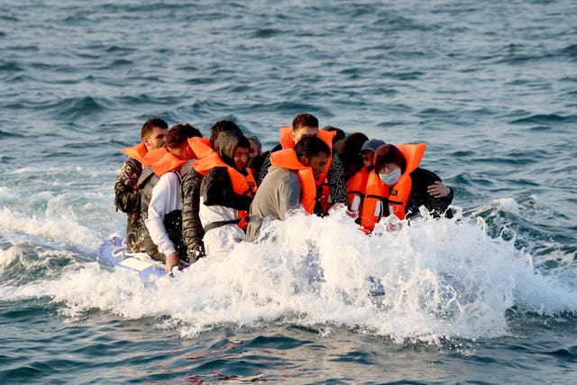 <p>Migrants crossing the Channel in a small boat headed in the direction of Dover last year</p>