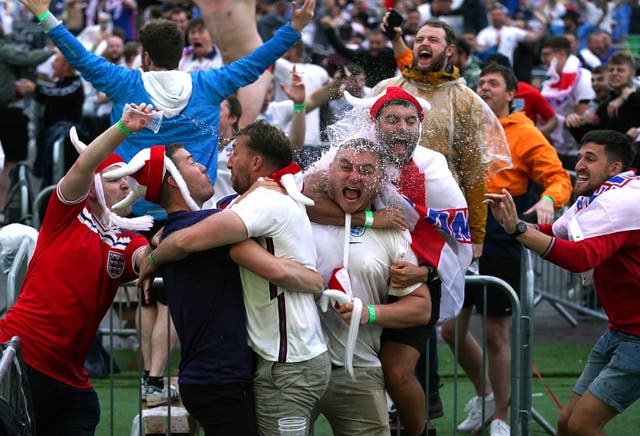 <p>Fans in Manchester celebrate an England goal</p>