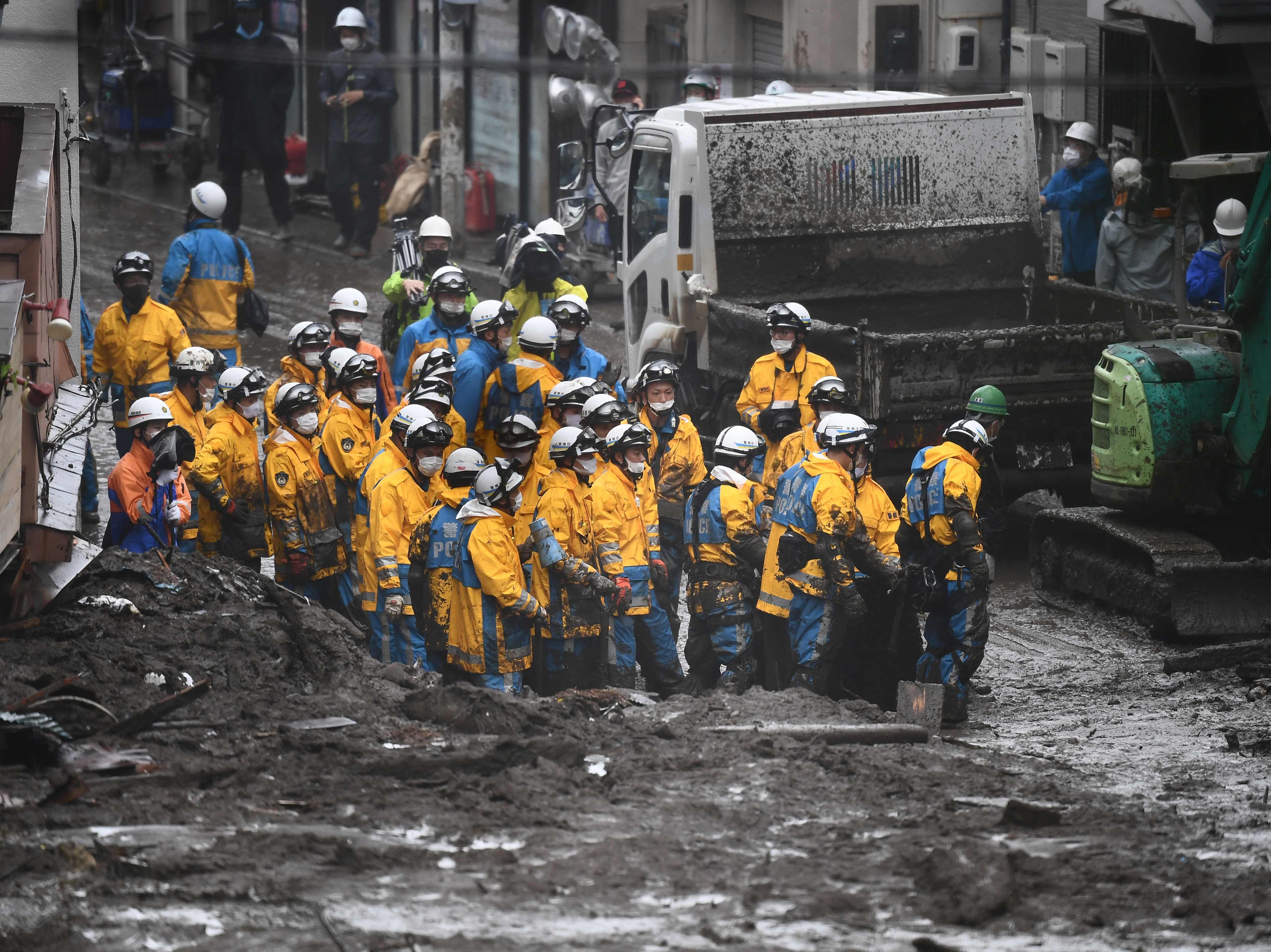 <p>Police at the scene of the landslide in Atami, Japan</p>