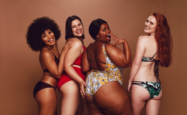 Four women wearing bikinis