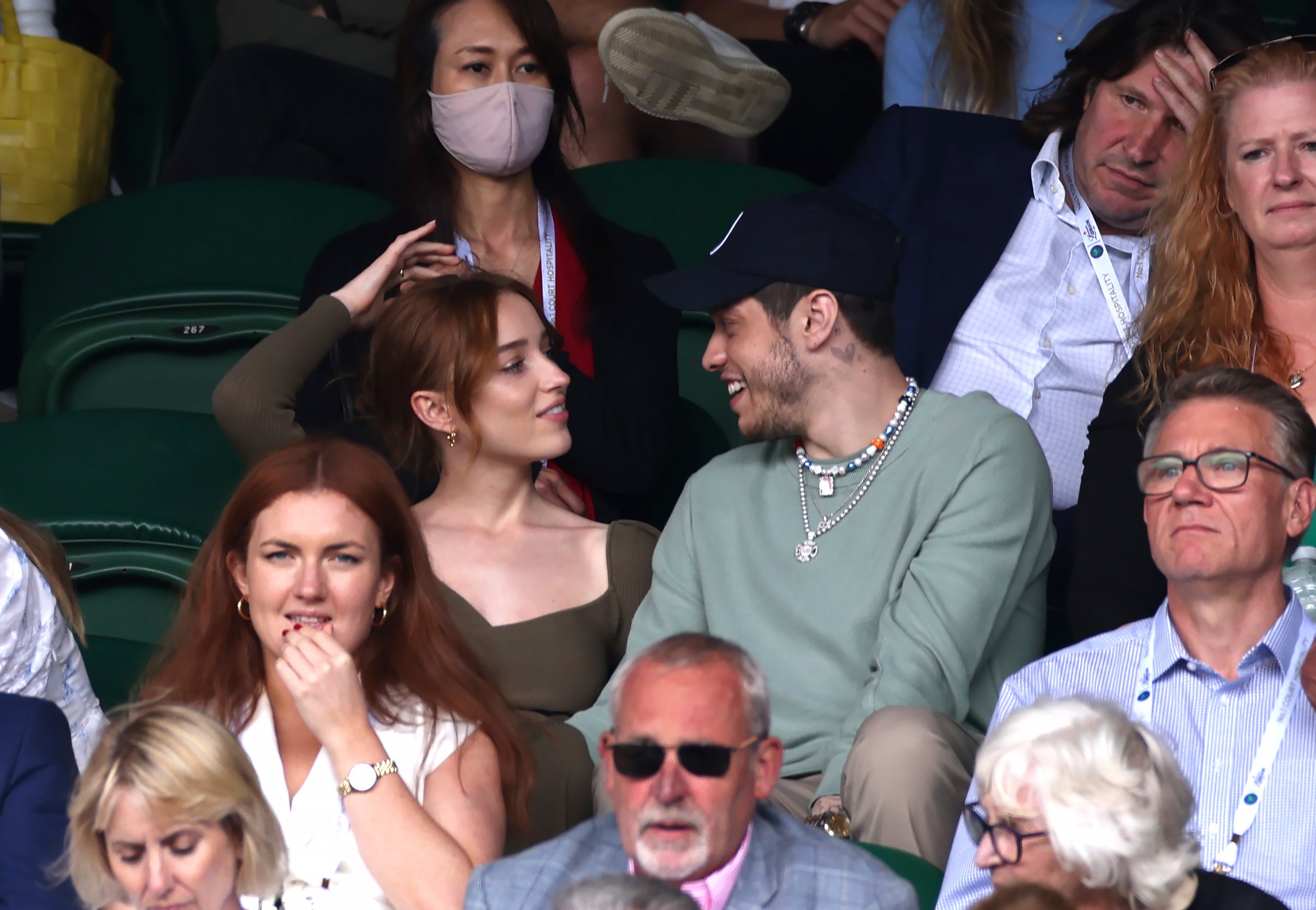 Phoebe Dynevor and Pete Davidson watch a match at centre court on day six of Wimbledon