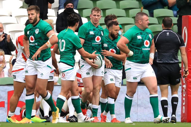 <p>Chris Farrell, centre, scored Ireland's first try in the weekend victory over Japan before being forced off injured</p>