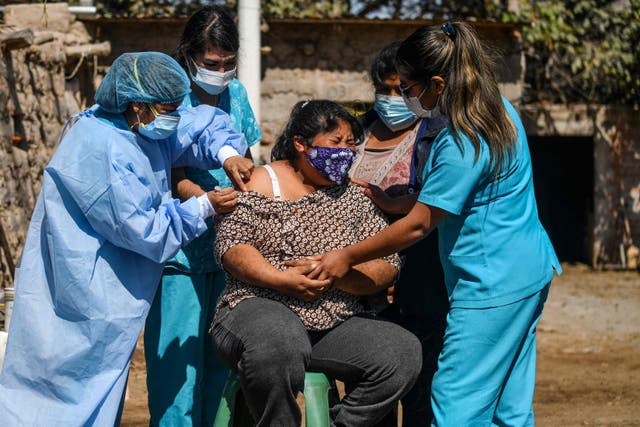 <p>A woman is vaccinated in Arequipa, southern Peru</p>