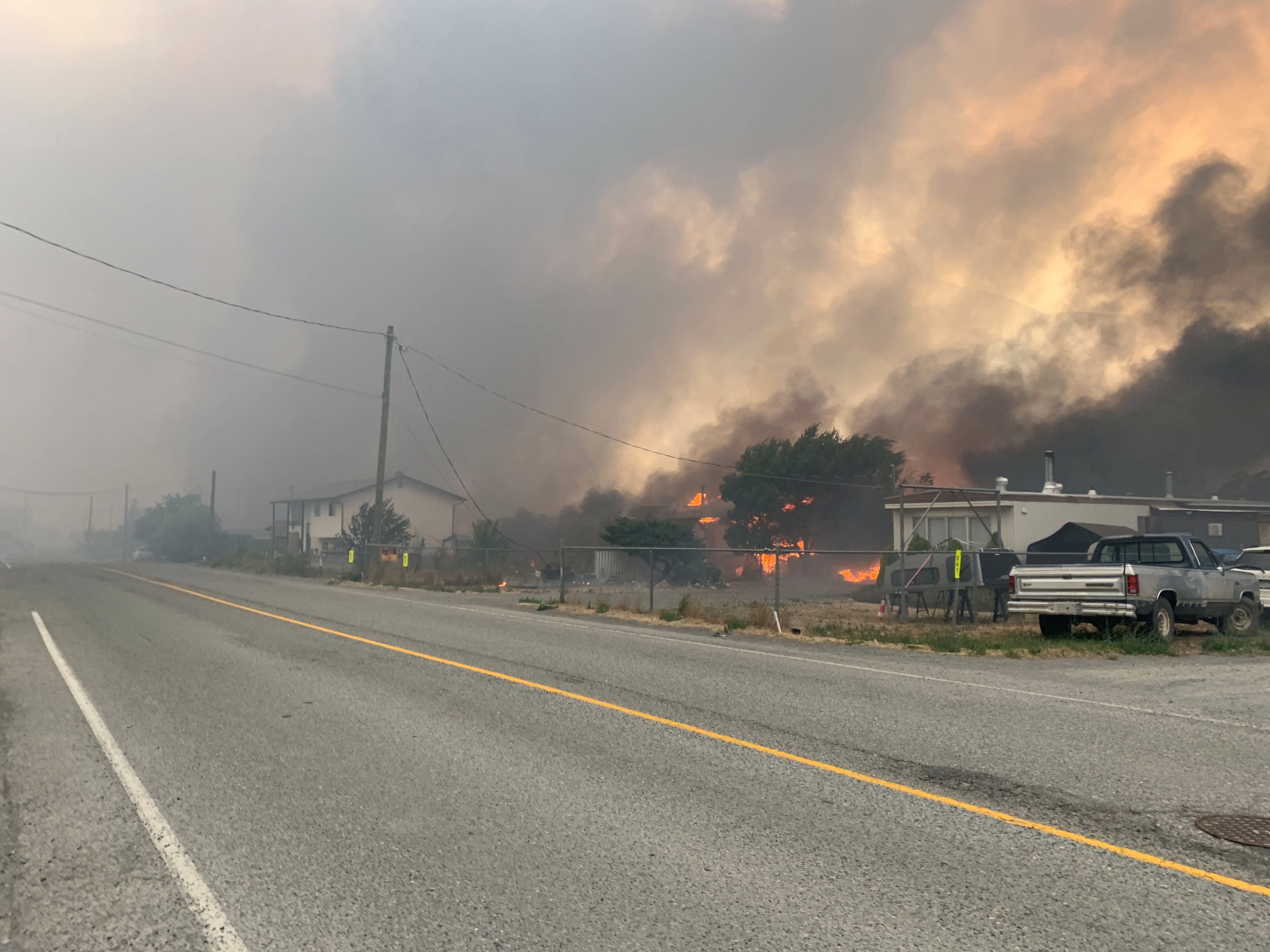 Smoke rises above the small western Canadian town of Lytton after wildfires forced its residents to evacuate, in Lytton, British Columbia, Canada 30, 2021.